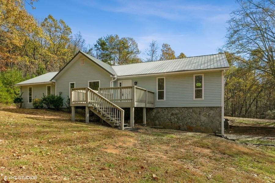 359 Carter Mountain Road Southeast Fairmount, GA 30139 - Photo 1 of 1 a view of a house with a yard