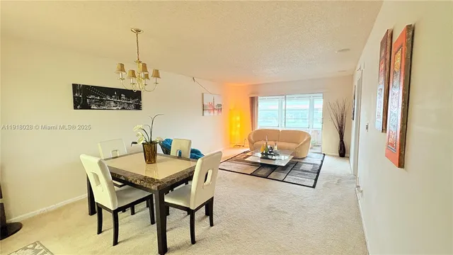 a view of a livingroom with furniture and window