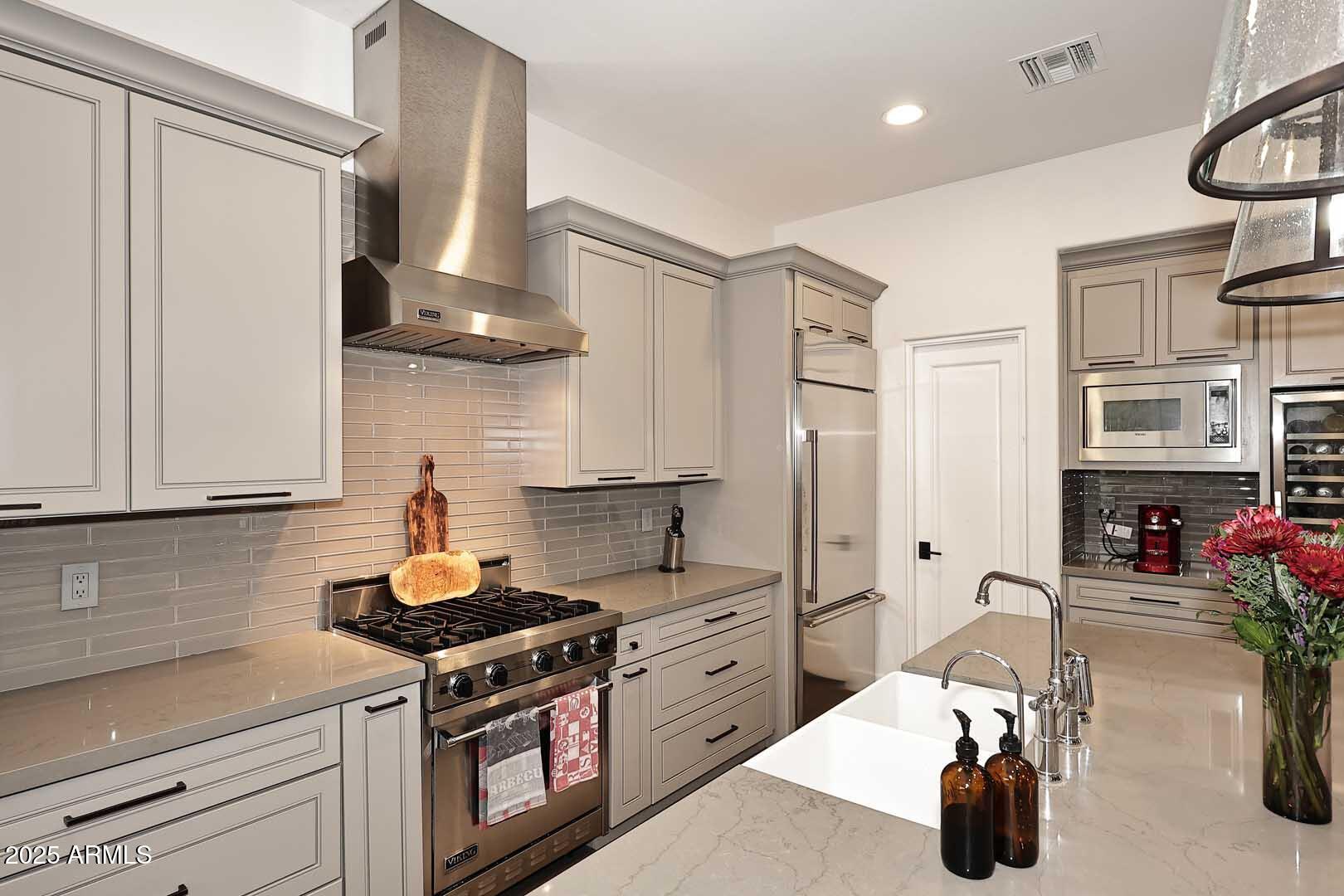 2979 South Lookout Ridge Gold Canyon, AZ 85118 - Photo 11 of 51 a kitchen with stainless steel appliances a sink and cabinets