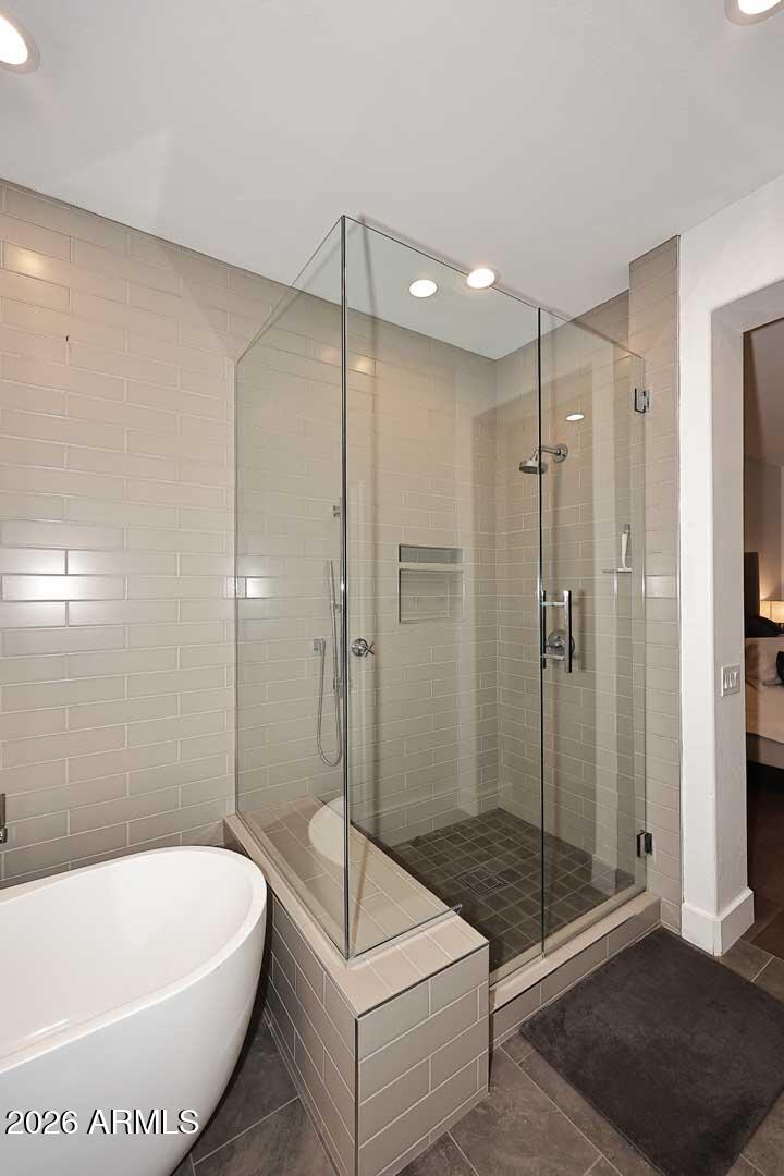 2979 South Lookout Ridge Gold Canyon, AZ 85118 - Photo 19 of 51 a bathroom with a bathtub and a shower