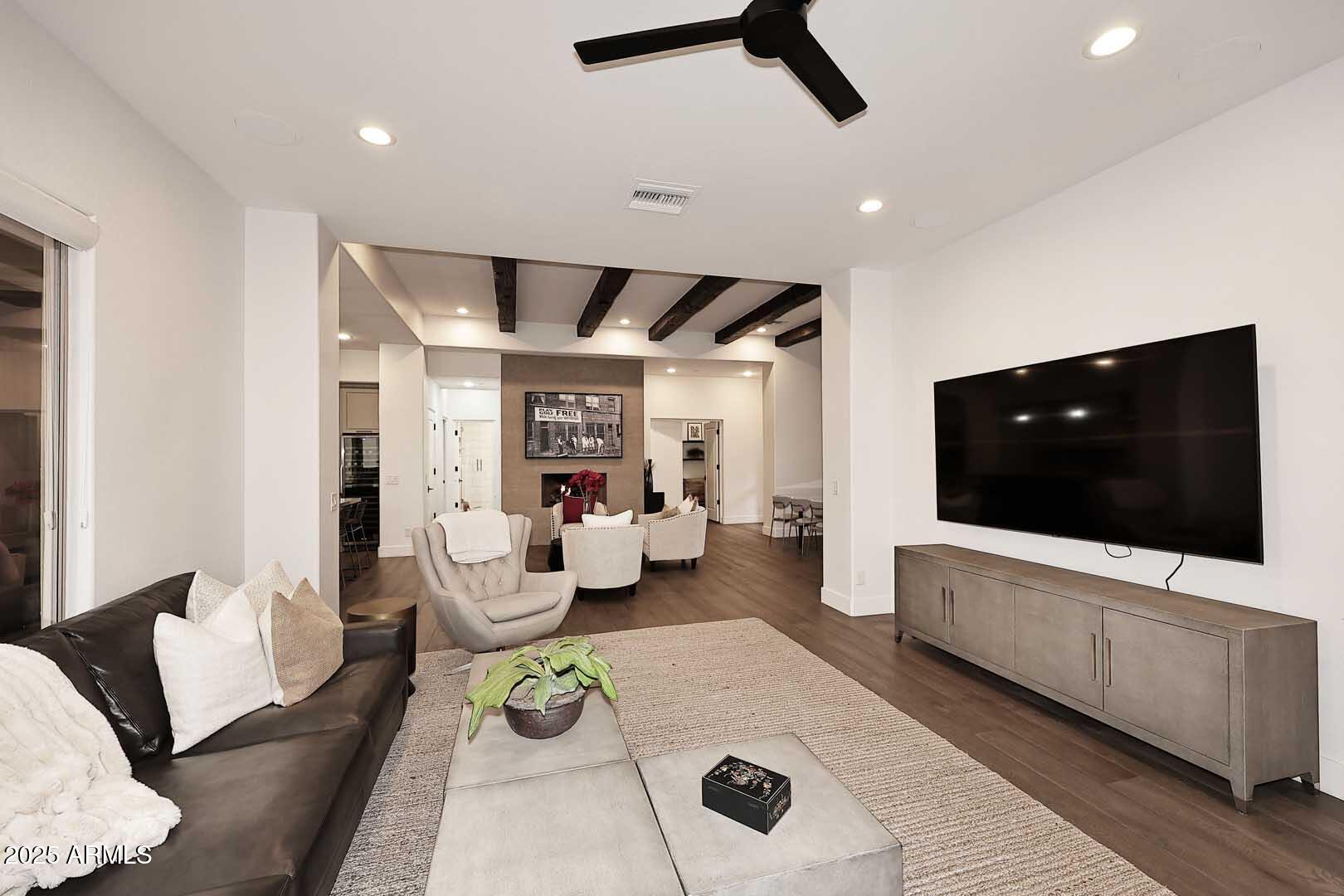 2979 South Lookout Ridge Gold Canyon, AZ 85118 - Photo 4 of 51 a living room with furniture and a flat screen tv