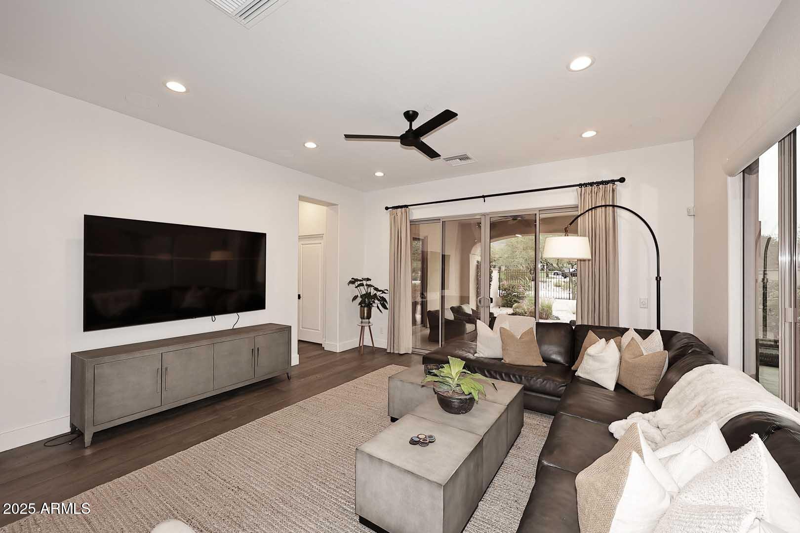 2979 South Lookout Ridge Gold Canyon, AZ 85118 - Photo 5 of 51 a living room with furniture and a flat screen tv