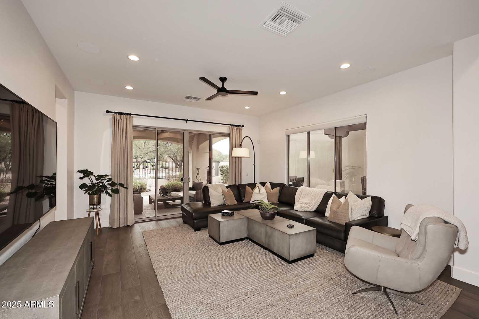 2979 South Lookout Ridge Gold Canyon, AZ 85118 - Photo 6 of 51 a living room with furniture and a flat screen tv