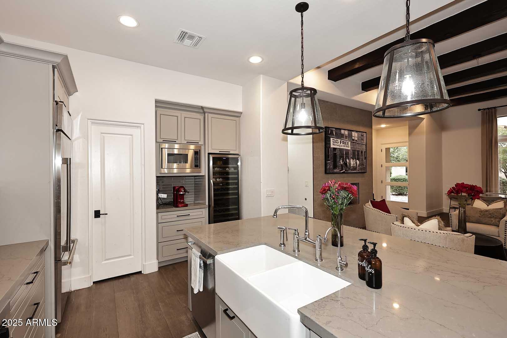 2979 South Lookout Ridge Gold Canyon, AZ 85118 - Photo 8 of 51 a kitchen with stainless steel appliances granite countertop a sink refrigerator and cabinets