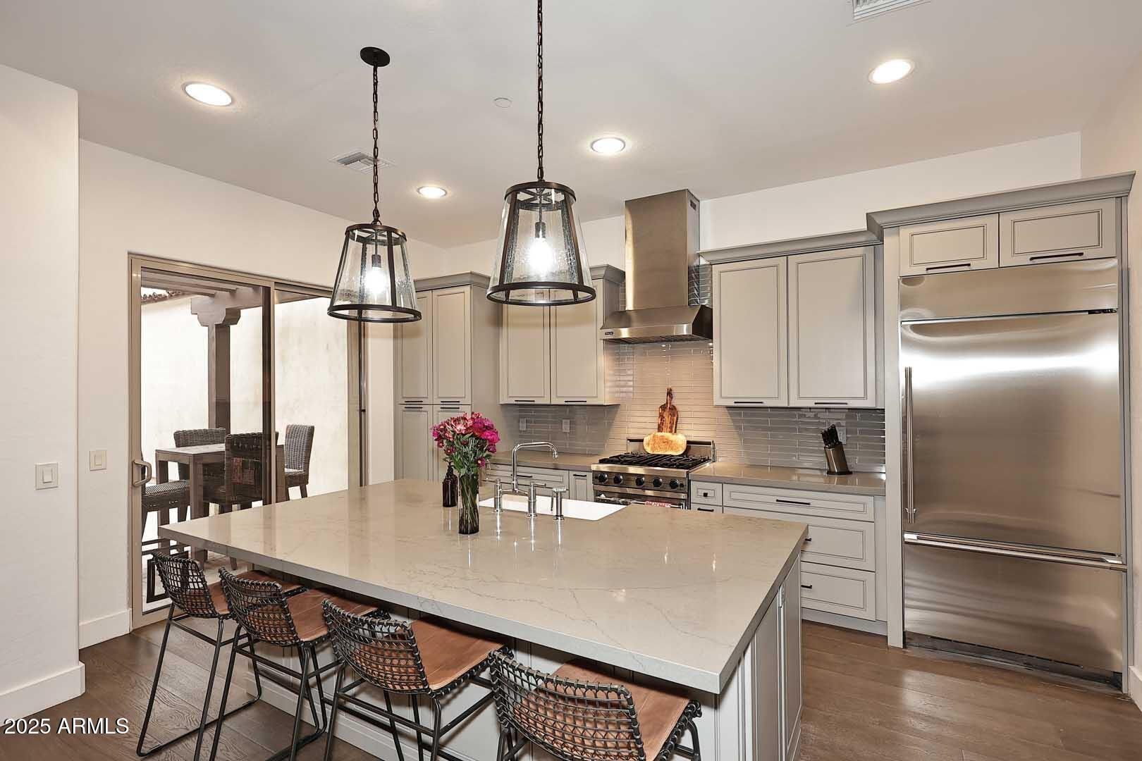 2979 South Lookout Ridge Gold Canyon, AZ 85118 - Photo 9 of 51 a kitchen with kitchen island a large counter top appliances and cabinets