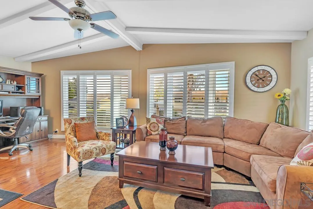 18218 Paradise Mountain Road, Unit 203 Valley Center, CA 92082 - Photo 16 of 68 a living room with furniture and a large window