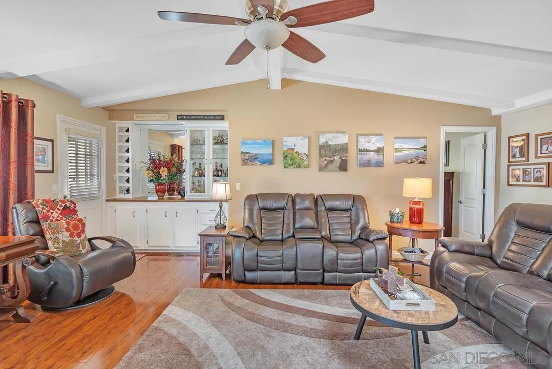 18218 Paradise Mountain Road, Unit 203 Valley Center, CA 92082 - Photo 27 of 68 a living room with furniture and a large window