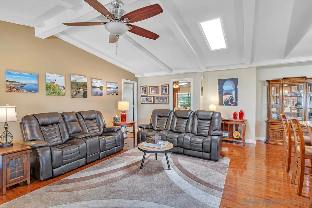 18218 Paradise Mountain Road, Unit 203 Valley Center, CA 92082 - Photo 28 of 68 a living room with furniture and wooden floor