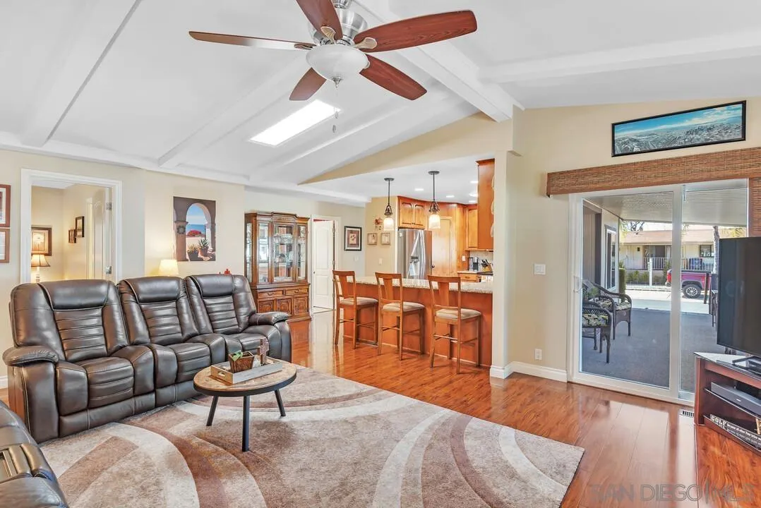 18218 Paradise Mountain Road, Unit 203 Valley Center, CA 92082 - Photo 29 of 68 a living room with furniture and wooden floor