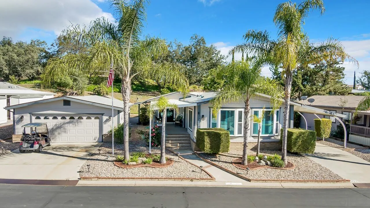 18218 Paradise Mountain Road, Unit 203 Valley Center, CA 92082 - Photo 48 of 68 a view of a dinning table and chairs in patio