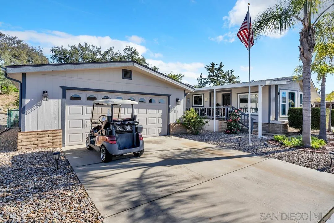 18218 Paradise Mountain Road, Unit 203 Valley Center, CA 92082 - Photo 5 of 68 a view of a house with a patio