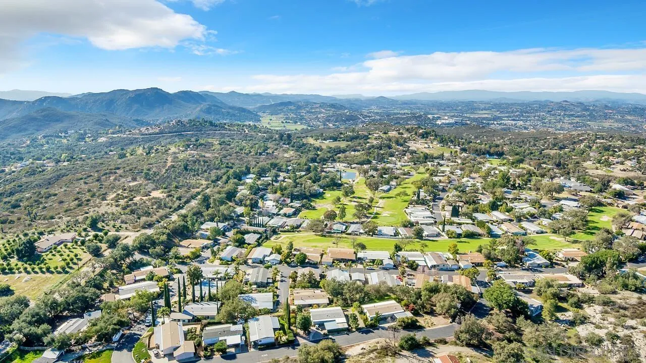 18218 Paradise Mountain Road, Unit 203 Valley Center, CA 92082 - Photo 52 of 68 an aerial view of residential houses with outdoor space