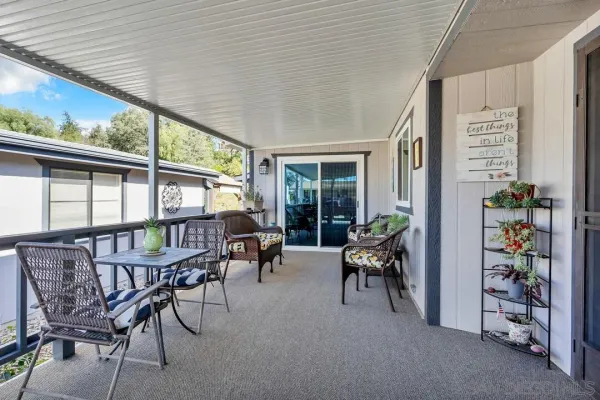a view of a chairs and table in patio