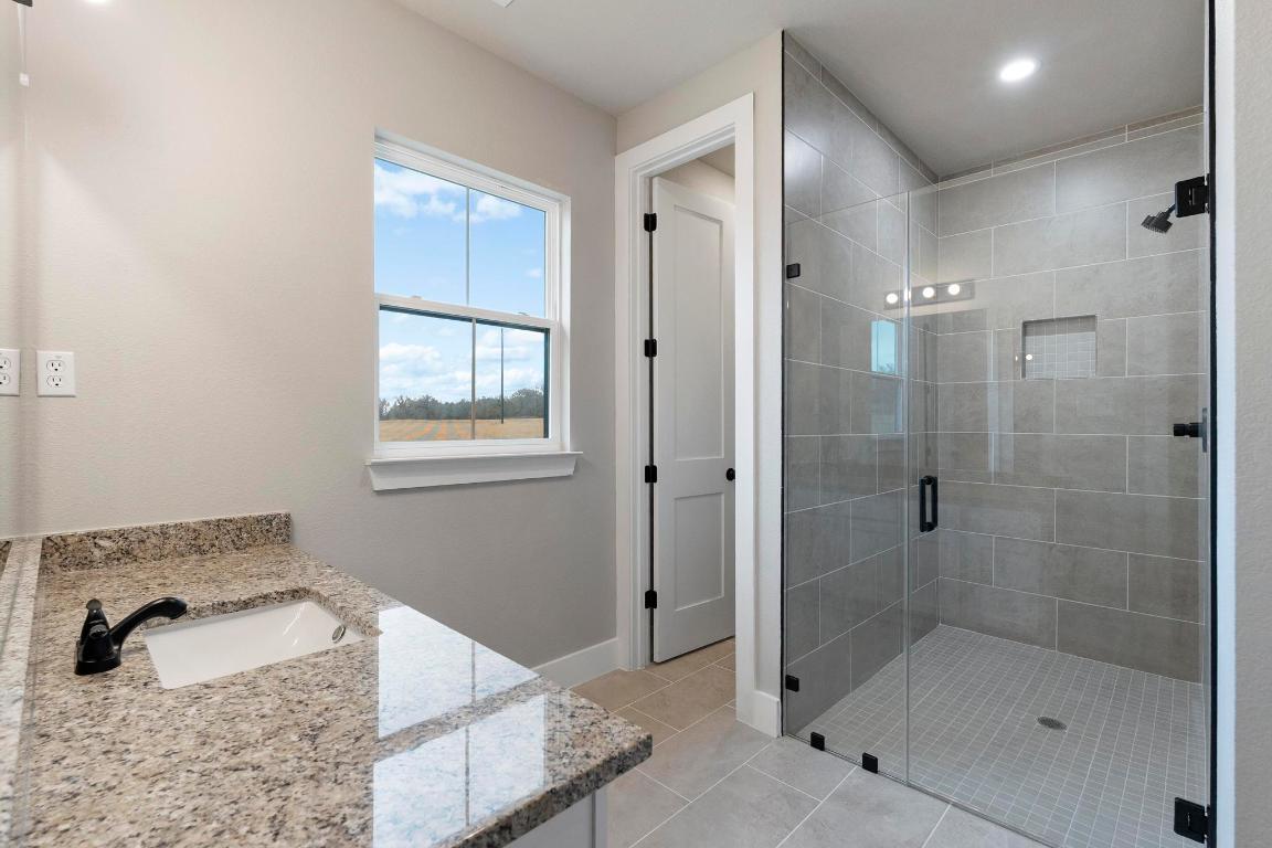 16544 Fm 112 Thrall, TX 76578 - Photo 21 of 28 a bathroom with a bathtub and shower