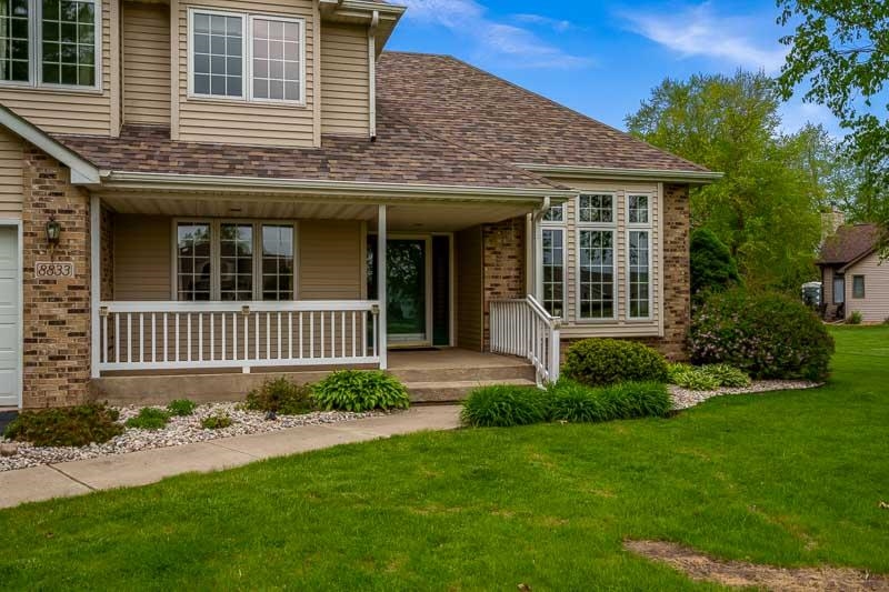 8833 West Ridge Drive Belvidere, IL 61008 - Photo 2 of 65 front view of a house with a yard
