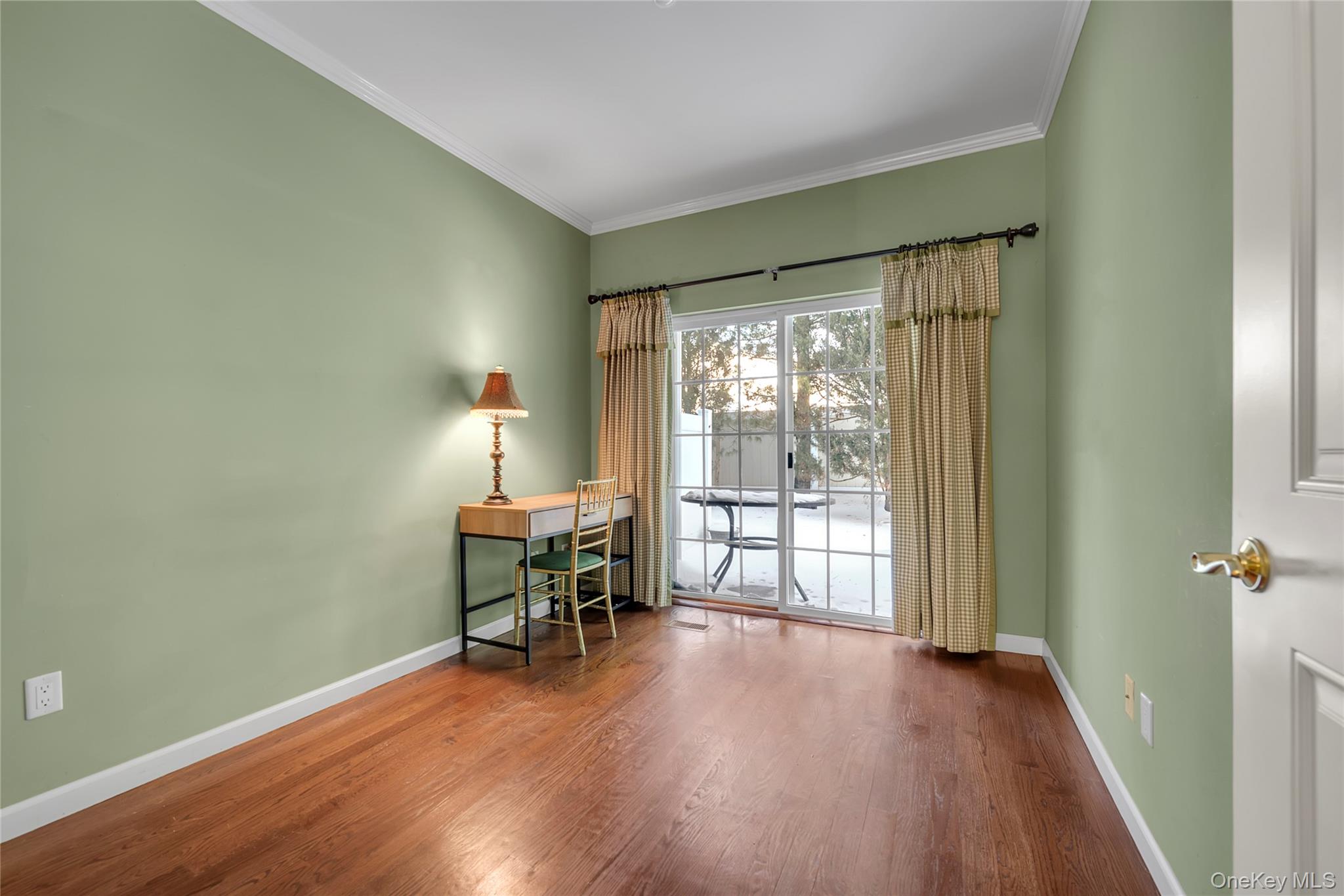 286 Spring Drive, Unit 286 East Meadow, NY 11554 - Photo 11 of 27 a view of a room with wooden floor lounge chair and windows