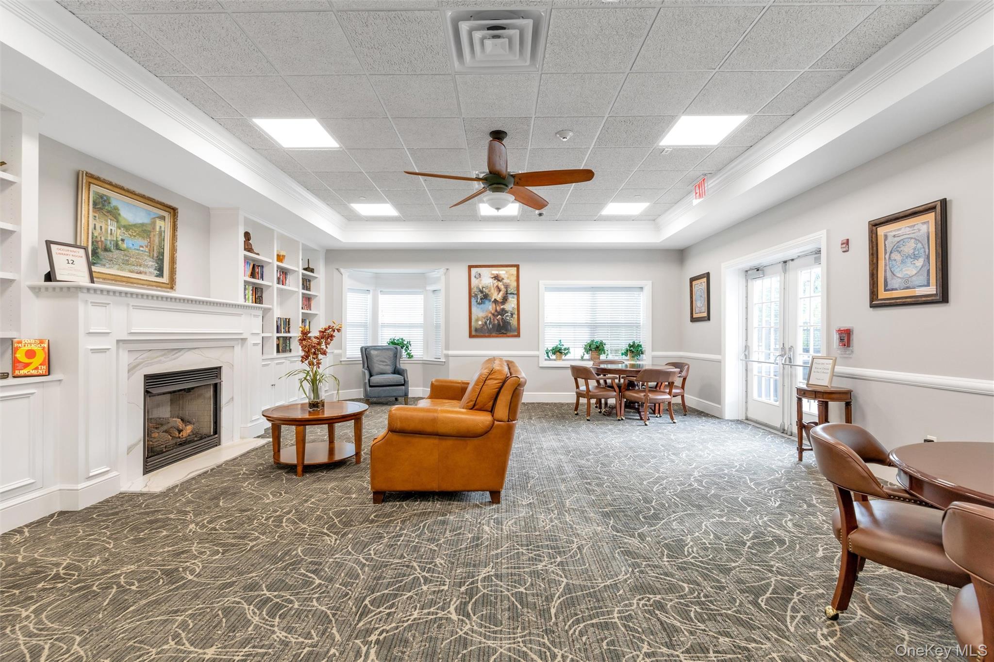 286 Spring Drive, Unit 286 East Meadow, NY 11554 - Photo 20 of 27 a living room with furniture and a fireplace