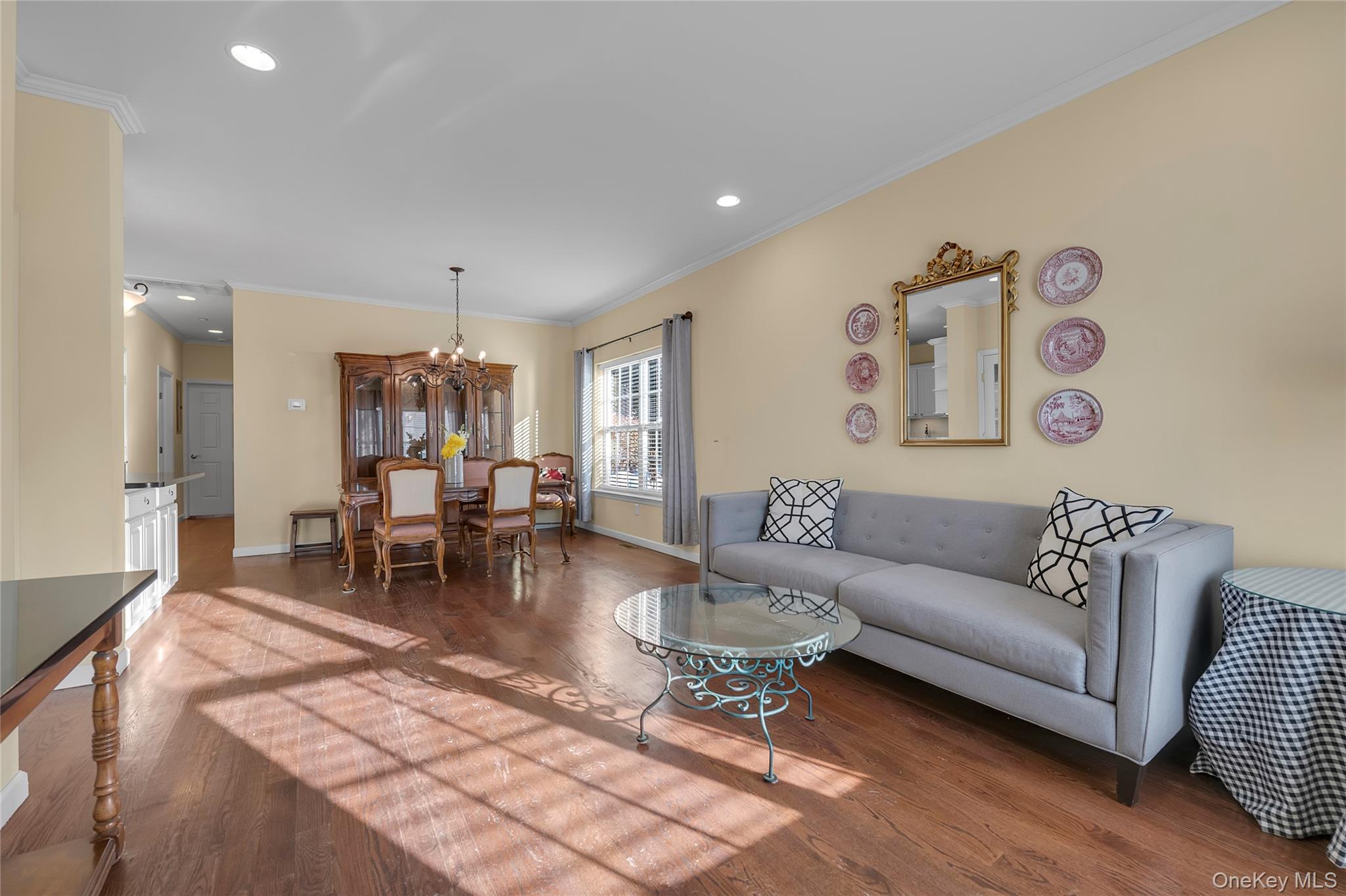 286 Spring Drive, Unit 286 East Meadow, NY 11554 - Photo 4 of 27 a living room with furniture and a table
