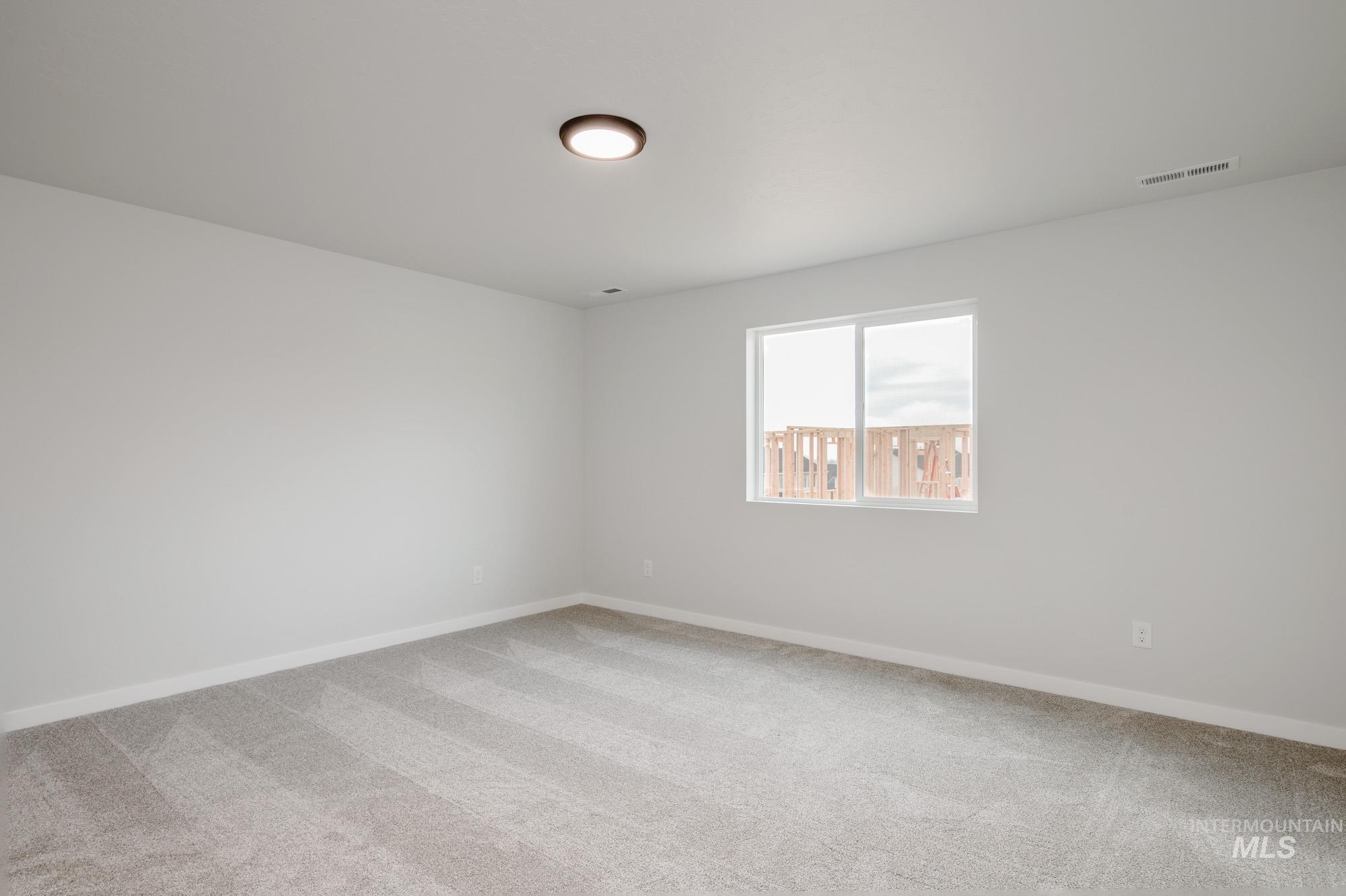 3281 North Waterbrook Way Star, ID 83669 - Photo 18 of 21 Carpeted spare room featuring baseboards