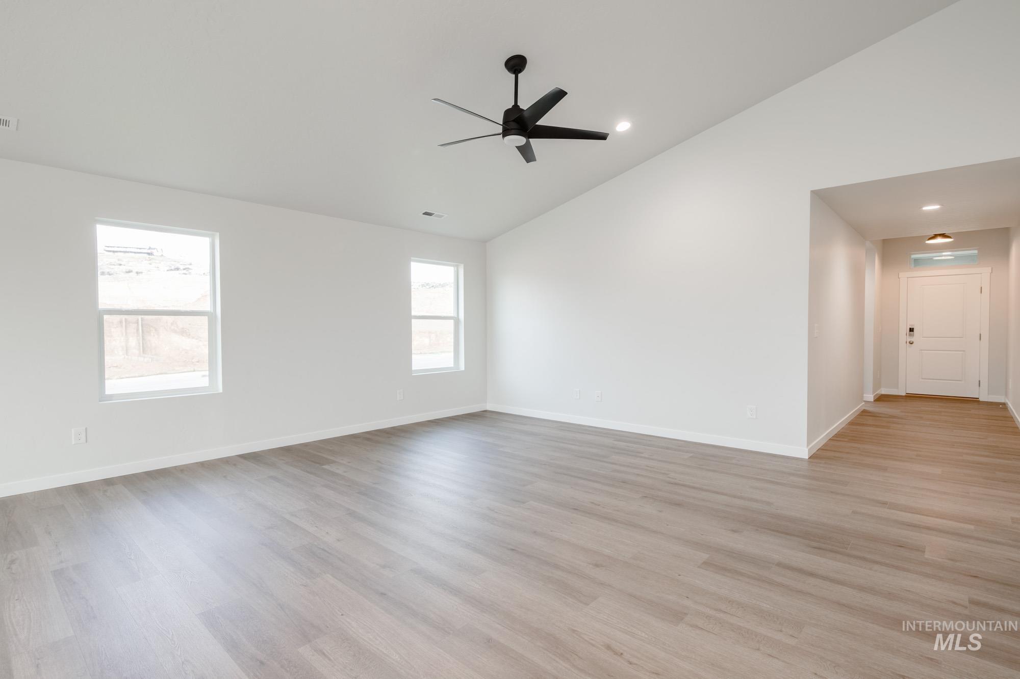 3281 North Waterbrook Way Star, ID 83669 - Photo 10 of 21 Empty room with light wood-type flooring, recessed lighting, a ceiling fan, and high vaulted ceiling