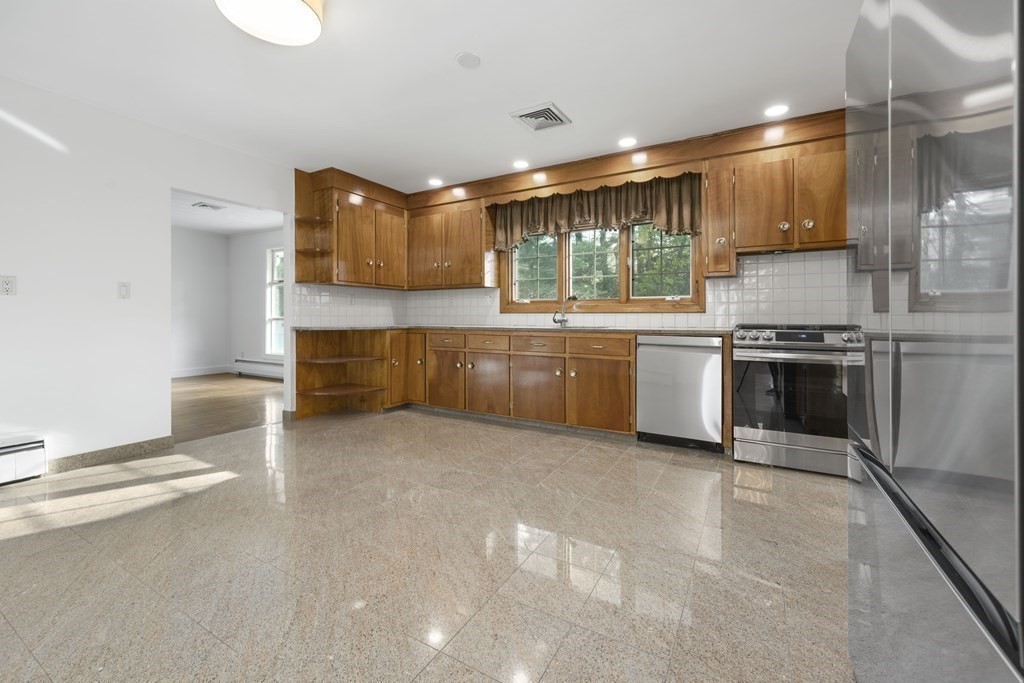 107 Boston Post Road Wayland, MA 01778 - Photo 12 of 42 a kitchen with stainless steel appliances granite countertop a sink and cabinets