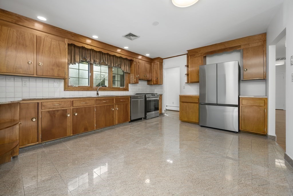 107 Boston Post Road Wayland, MA 01778 - Photo 14 of 42 a kitchen with stainless steel appliances granite countertop a refrigerator and a sink