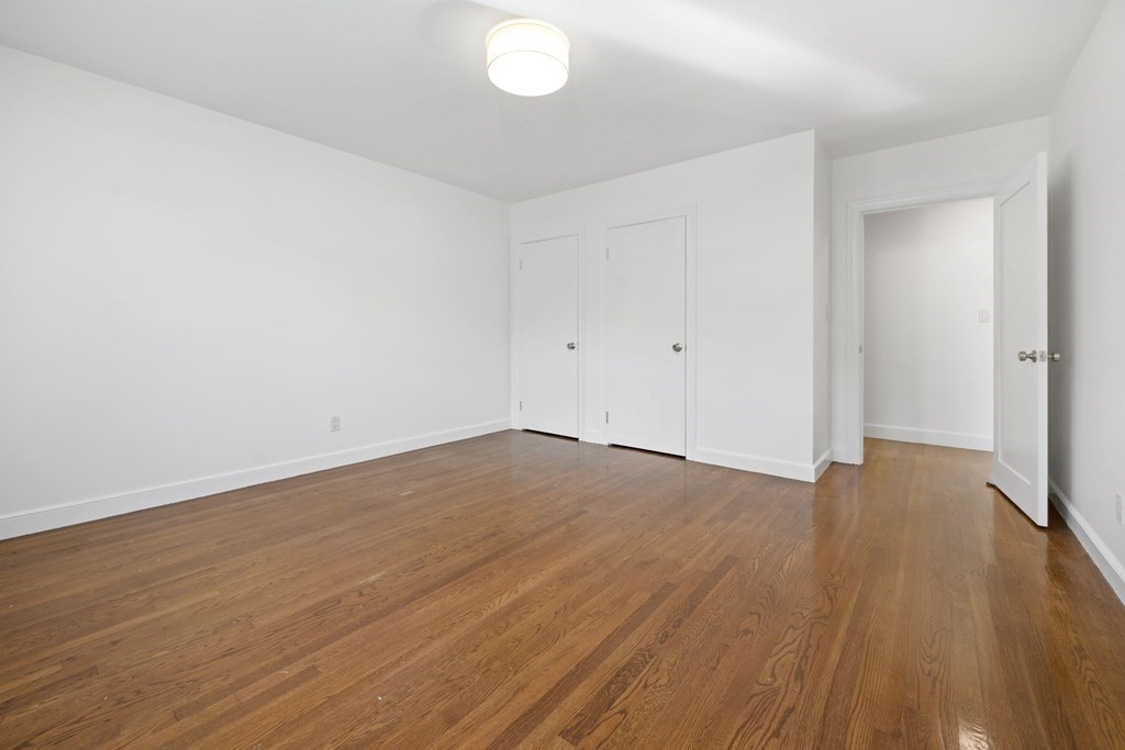 107 Boston Post Road Wayland, MA 01778 - Photo 17 of 42 a view of empty room with wooden floor