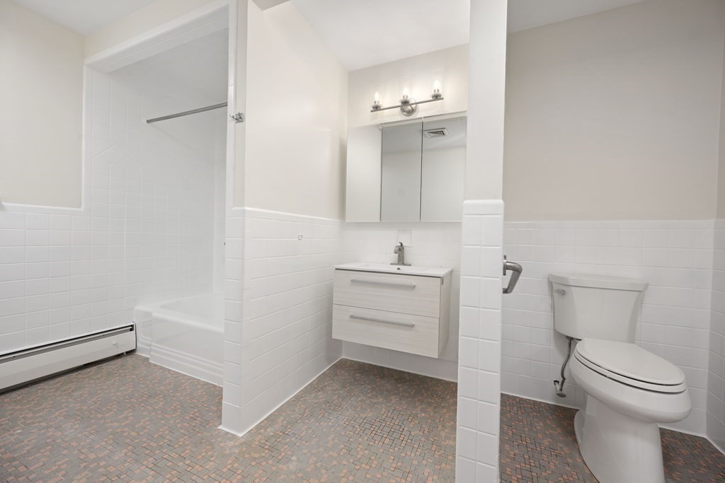 107 Boston Post Road Wayland, MA 01778 - Photo 18 of 42 a bathroom with a sink a toilet and vanity