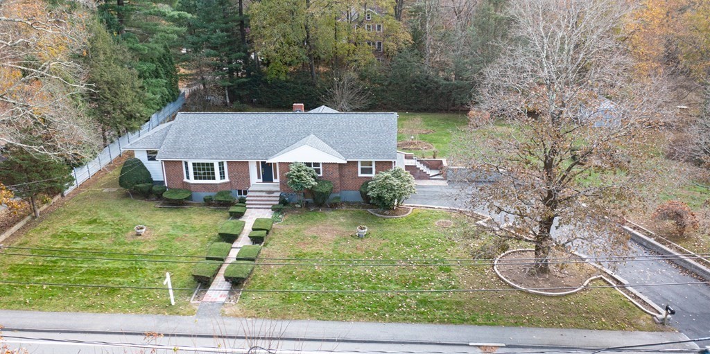 107 Boston Post Road Wayland, MA 01778 - Photo 2 of 42 a backyard of a house with lots of green space