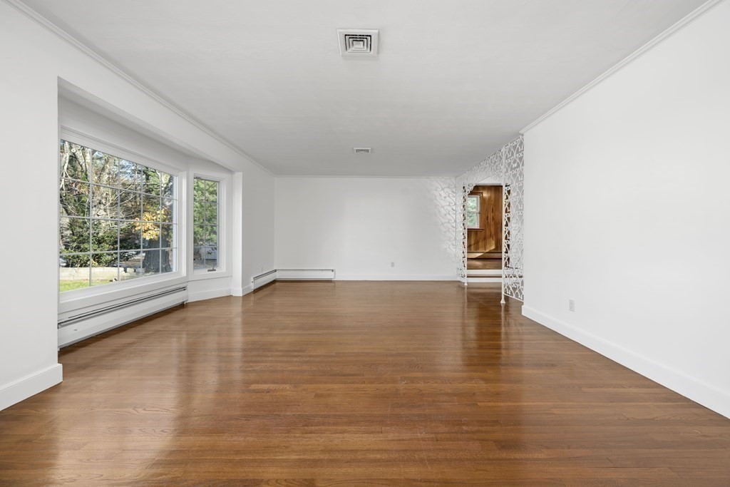 107 Boston Post Road Wayland, MA 01778 - Photo 25 of 42 a view of empty room with wooden floor and fan