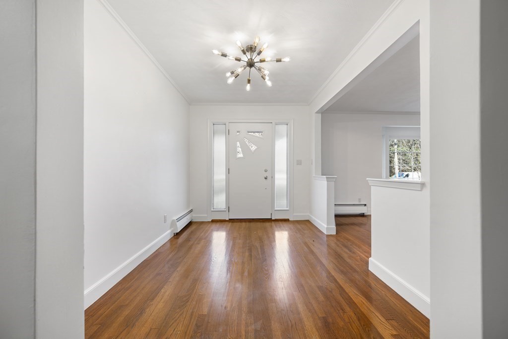 107 Boston Post Road Wayland, MA 01778 - Photo 26 of 42 a view of an empty room with wooden floor and a window