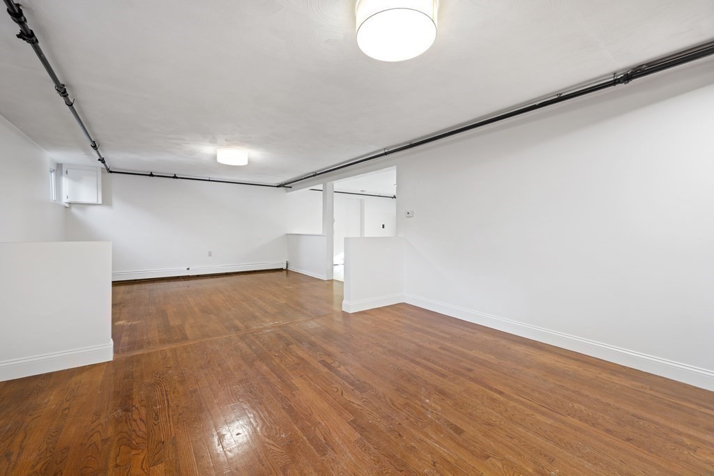 107 Boston Post Road Wayland, MA 01778 - Photo 30 of 42 a view of empty room with wooden floor