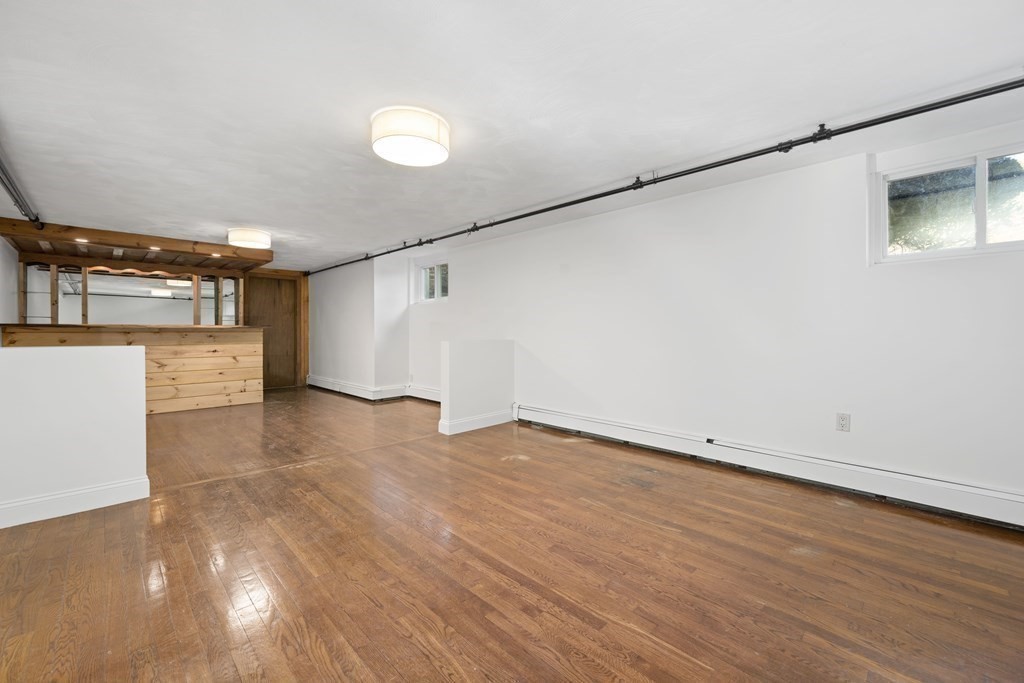 107 Boston Post Road Wayland, MA 01778 - Photo 31 of 42 wooden floor in an empty room