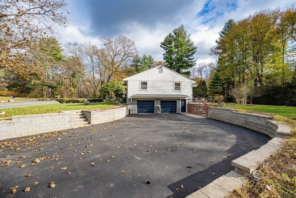 107 Boston Post Road Wayland, MA 01778 - Photo 6 of 42 a front view of a house with a yard