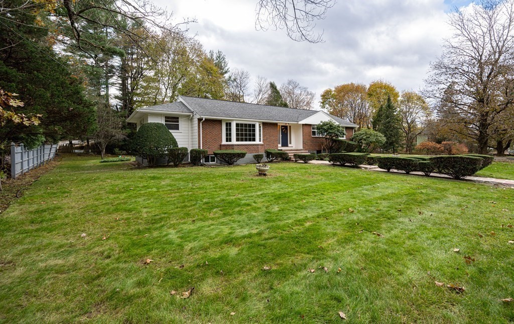 107 Boston Post Road Wayland, MA 01778 - Photo 9 of 42 a view of a house with a big yard and large trees