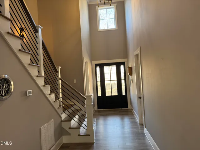 a view of an entryway with wooden floor