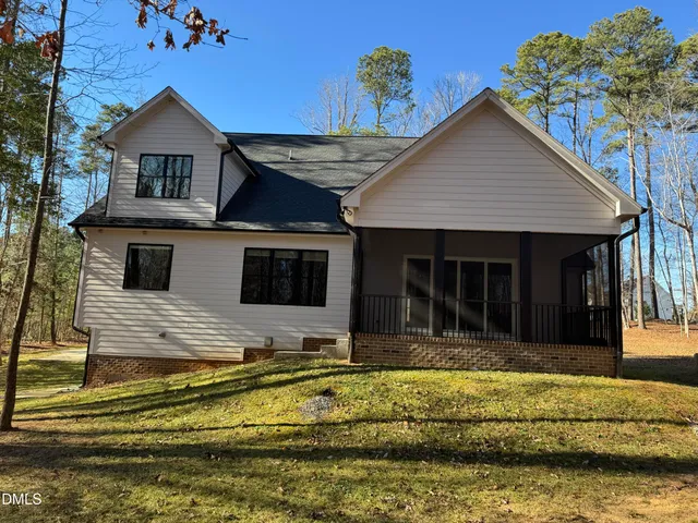 a view of house with swimming pool