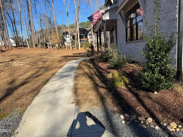 a view of path along with house and trees