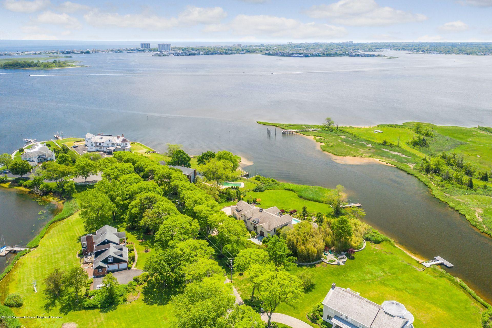 10 Edwards Point Road Rumson, NJ 07760 - Photo 40 of 40 a view of a lake with a lake in the background