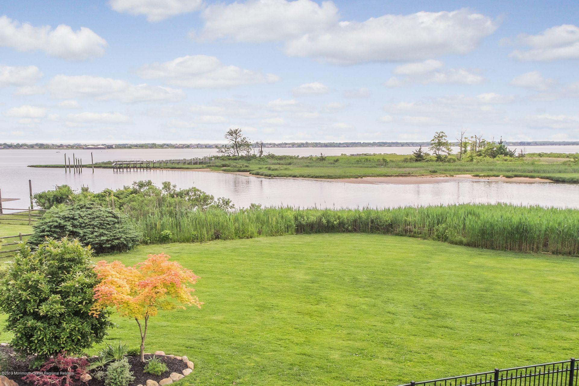 10 Edwards Point Road Rumson, NJ 07760 - Photo 8 of 40 a view of a lake with a big yard