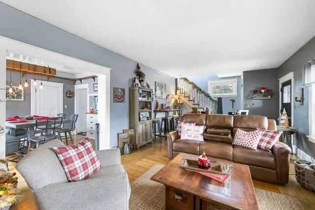a view of a dining room with furniture and a kitchen