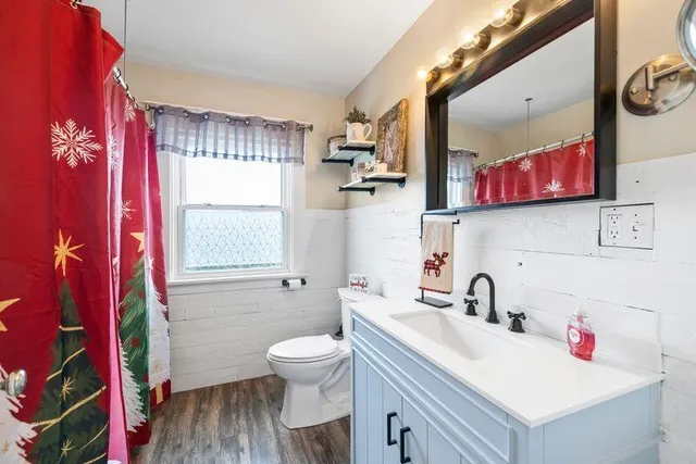 a bedroom with a bed and a tv in it