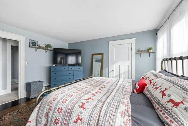 a view of a livingroom with furniture and a window
