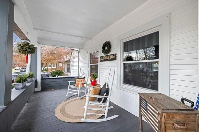 a view of a backyard with swimming pool