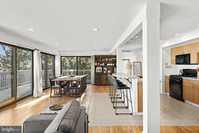 a dining table & chairs in a room