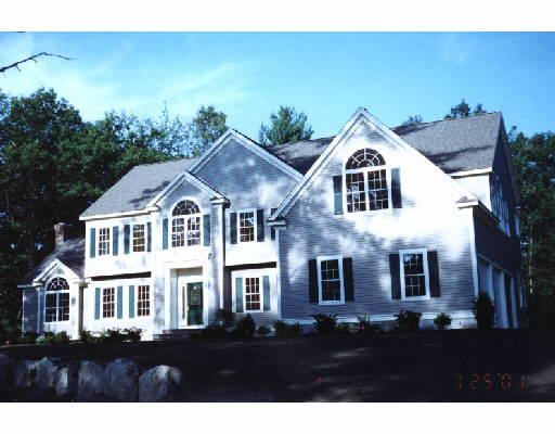 99 Lot 7 Colonial Ridge Boxborough, MA 01719 - Photo 1 of 1 a front view of a house with a yard