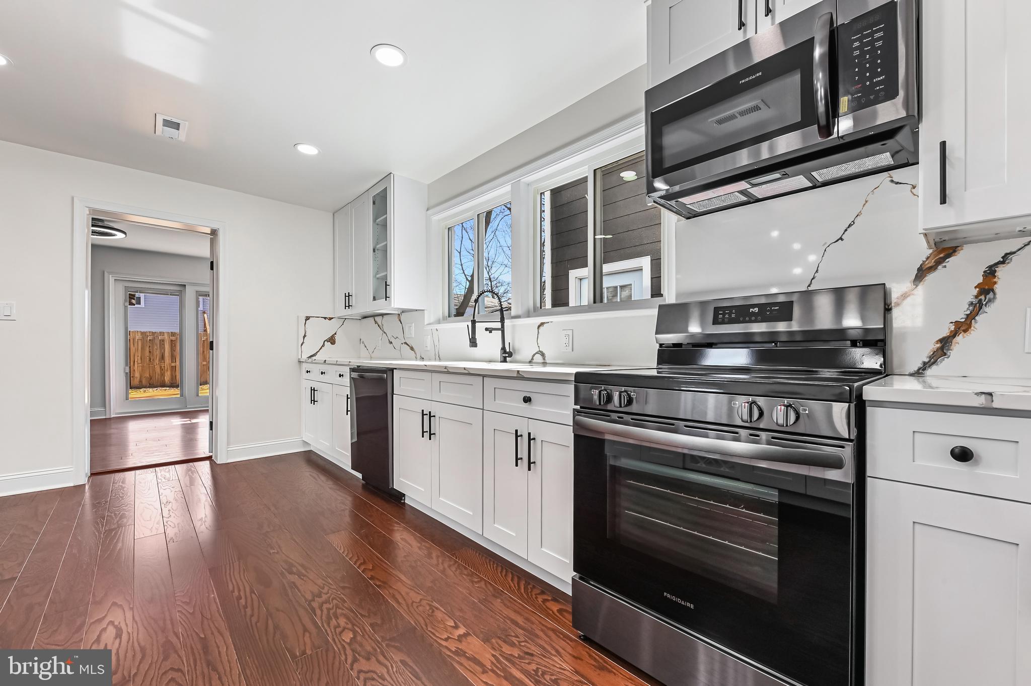 1637 Fairhill Drive Edgewater, MD 21037 - Photo 11 of 46 a kitchen with a stove and a microwave