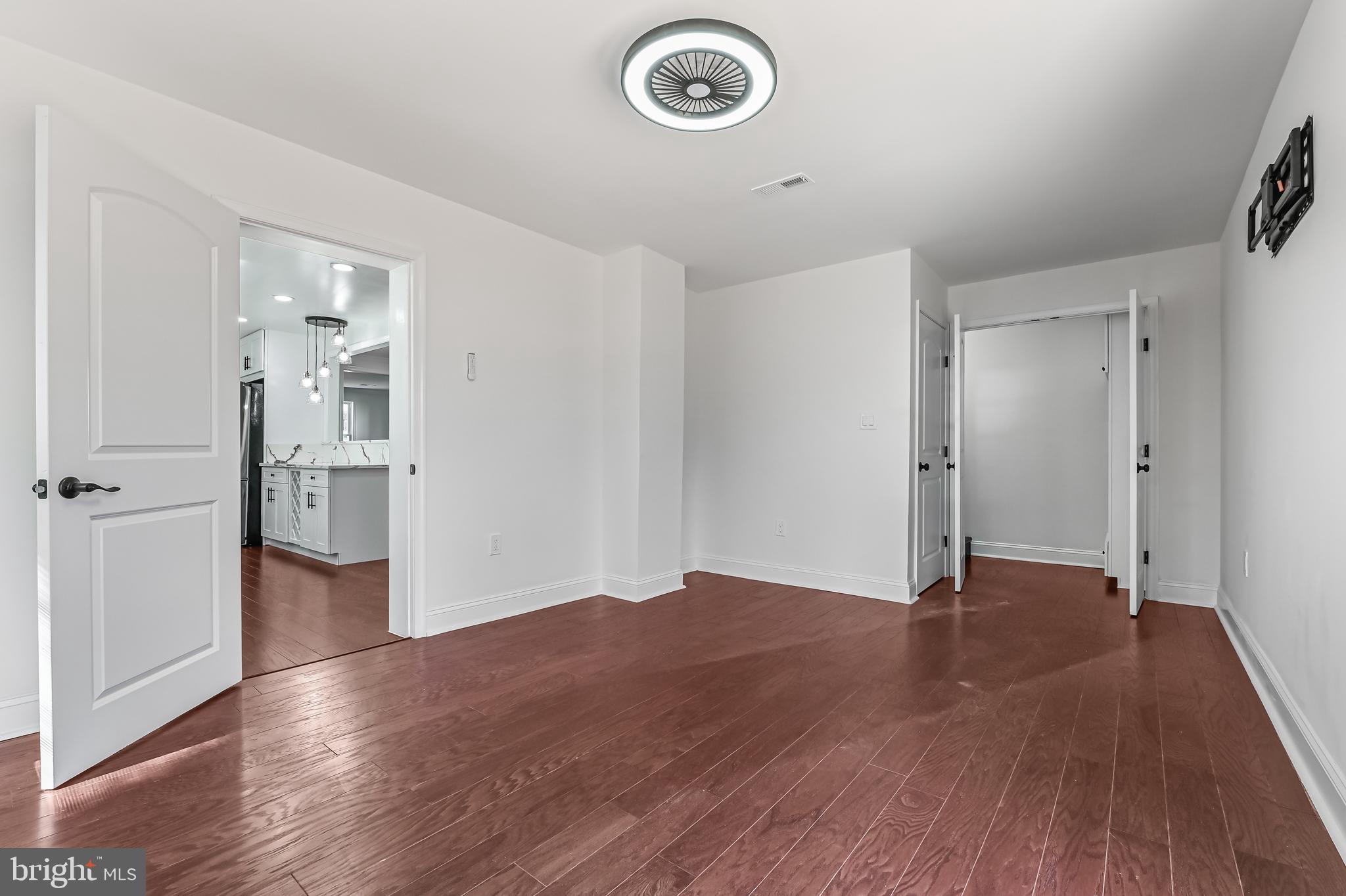 1637 Fairhill Drive Edgewater, MD 21037 - Photo 13 of 46 an empty room with wooden floor and a window