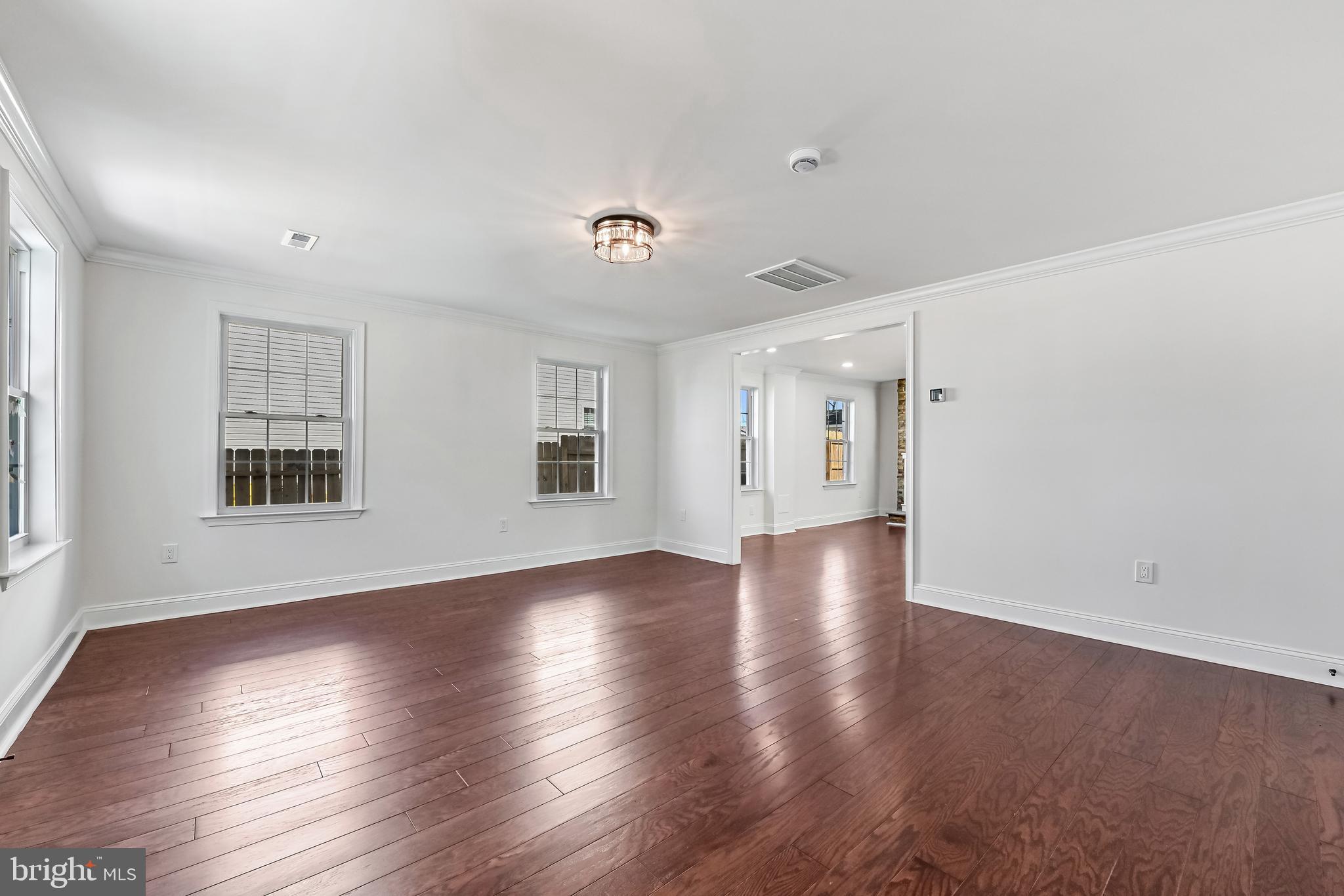 1637 Fairhill Drive Edgewater, MD 21037 - Photo 14 of 46 an empty room with wooden floor and windows
