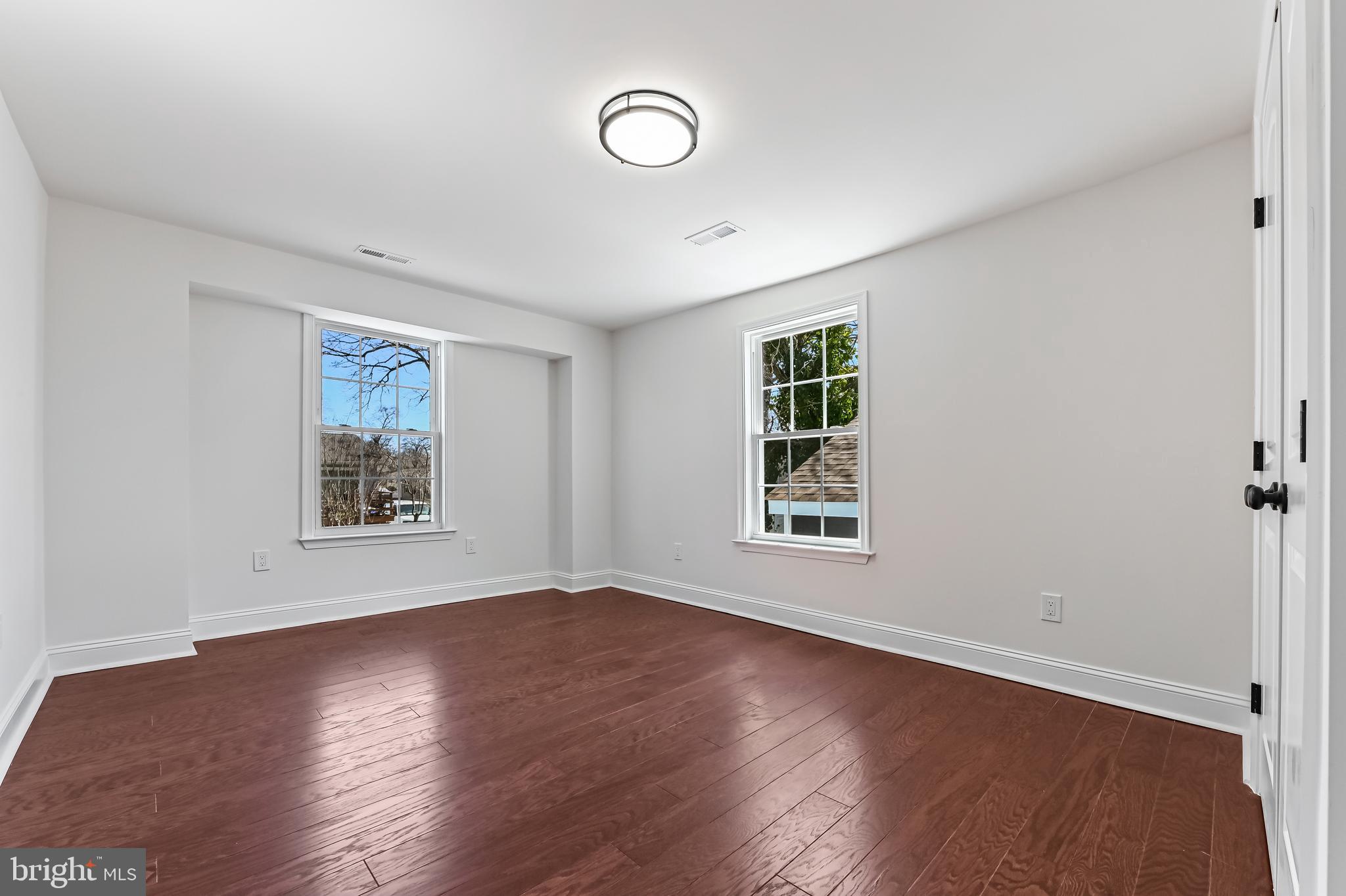 1637 Fairhill Drive Edgewater, MD 21037 - Photo 16 of 46 a view of an empty room with wooden floor and window